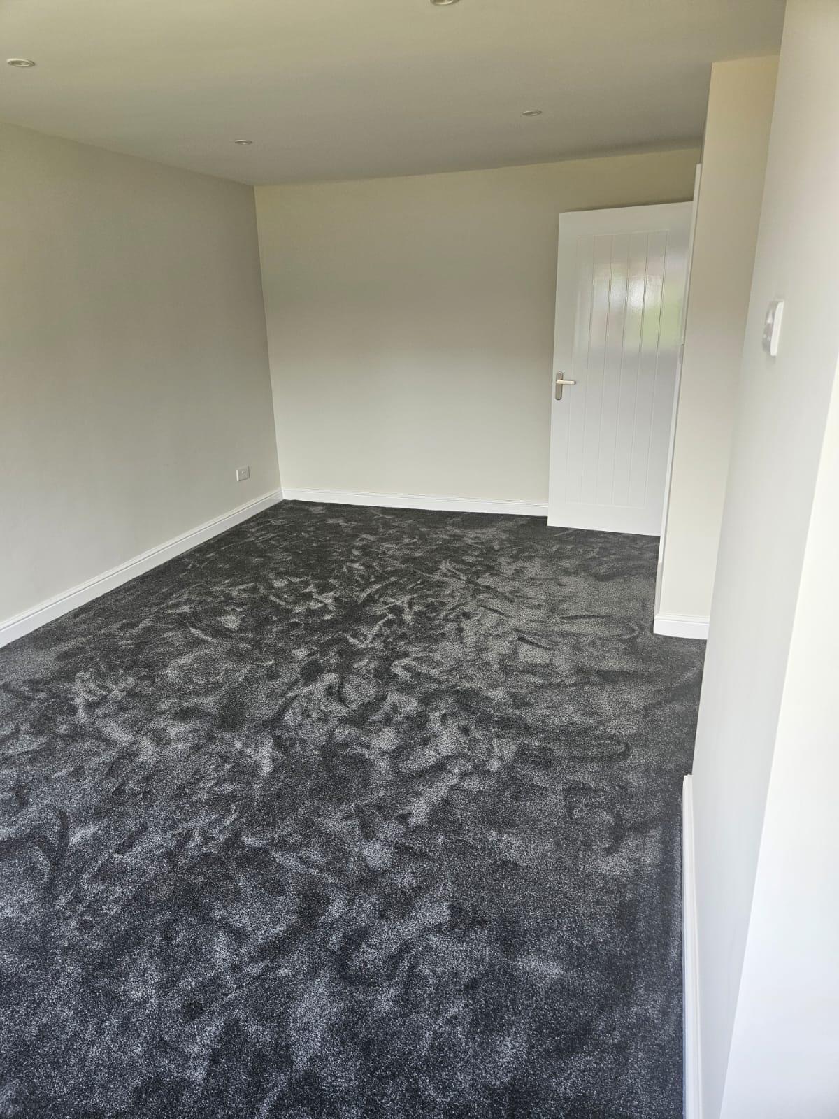 Charcoal carpet in newly decorated room